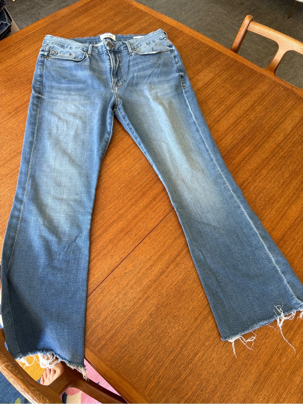 Frame Denim Light Blue Flare Jeans with Frayed Hem